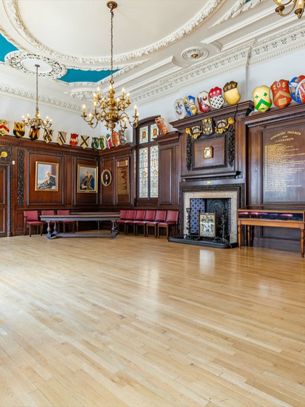 Stationers' Hall livery hall with wood panelling and chandeliers